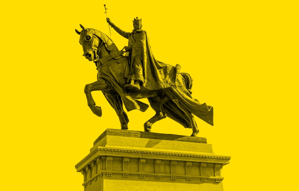 a photograph in a yellow tone of a sculpture of a man on a horse